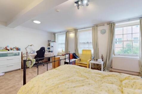 Bright and spacious master bedroom featuring th...