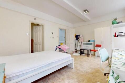 Bright and spacious master bedroom featuring a ...