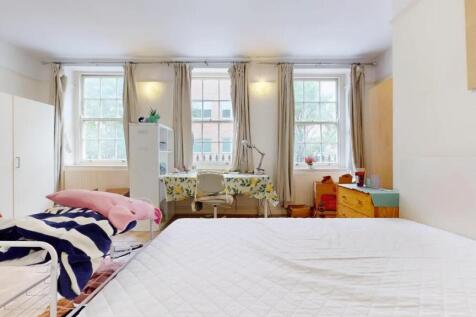 Bright and airy double bedroom featuring three ...