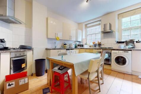 Bright and functional kitchen featuring large w...