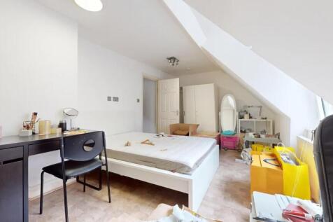 Bright and airy double bedroom with a large sla...