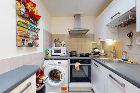 Bright and practical kitchen featuring modern w...