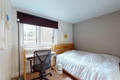 Bright single bedroom featuring a comfortable w...