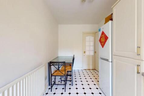 Bright and clean kitchen with classic black and...