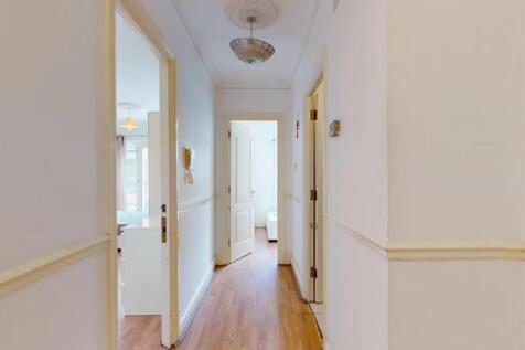 A clean and bright hallway featuring light-colo...