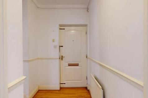 Bright and clean hallway with fresh white walls...