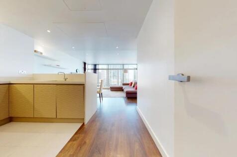 A spacious and modern living area with elegant ...