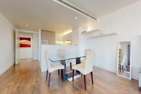 A modern living room featuring a sleek glass di...