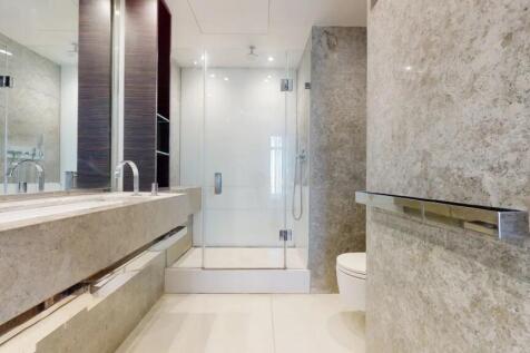 A sleek and modern bathroom suite featuring a s...