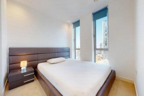 Bright and modern double bedroom featuring a la...