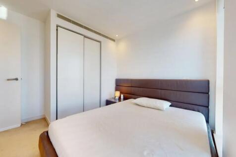 A modern double bedroom featuring a comfortable...