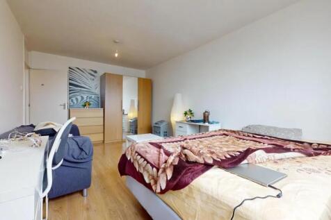 A spacious and well-organized master bedroom fe...