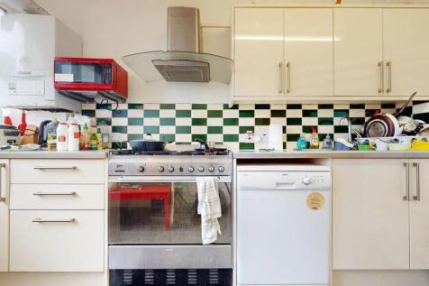 Bright kitchen with modern appliances including...