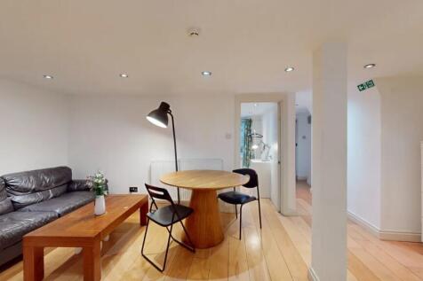 A modern living room featuring a comfortable bl...