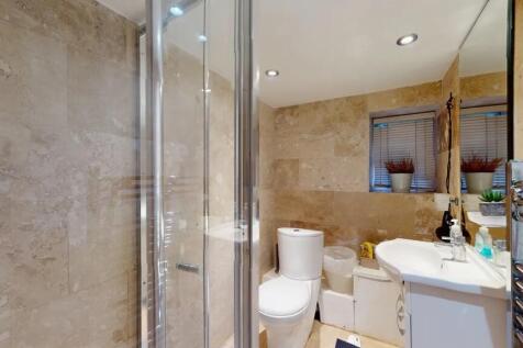 A modern and well-maintained bathroom featuring...