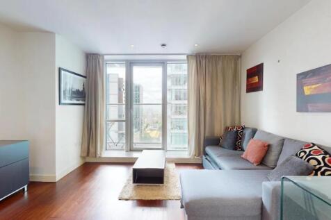 Bright and contemporary living room featuring a...