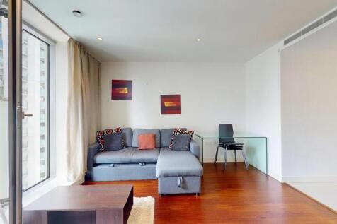Bright and modern living room with a comfortabl...