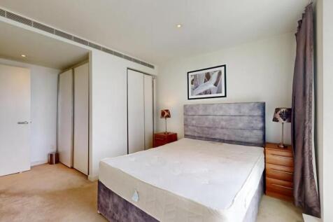 Bright and tidy double bedroom featuring a comf...