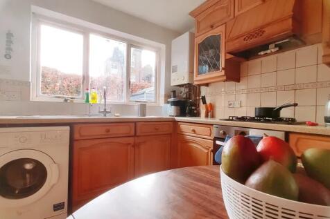 Bright and inviting kitchen featuring warm wood...