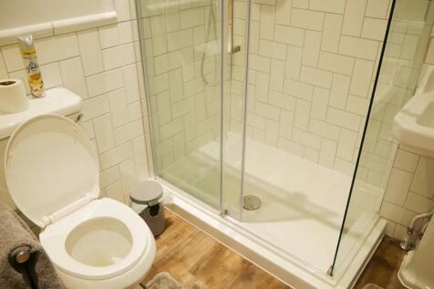 A stylish bathroom suite featuring a modern wal...