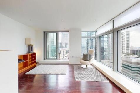 Bright and modern living room with floor-to-cei...