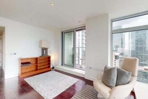 Bright and modern living room featuring floor-t...