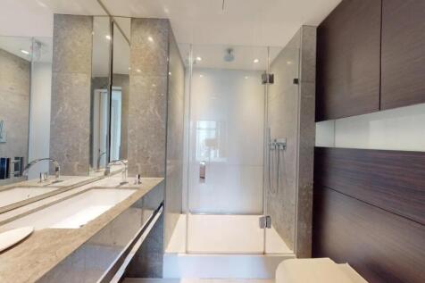 A modern and sleek bathroom suite featuring a s...