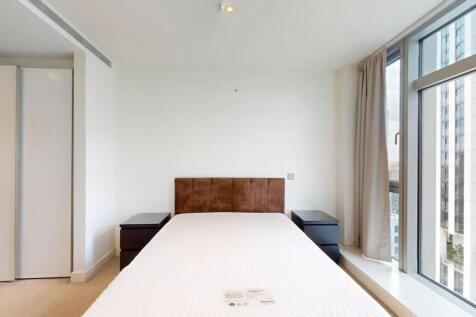 A bright and modern double bedroom featuring a ...