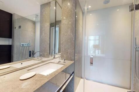 A modern and sleek bathroom suite featuring a l...