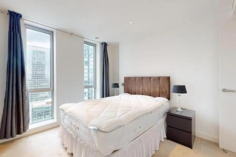 Bright and modern double bedroom featuring larg...