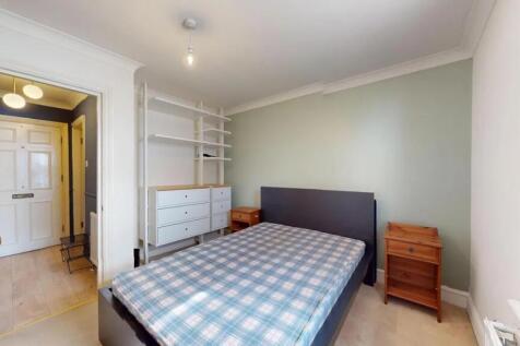 Bright and tidy double bedroom featuring a larg...