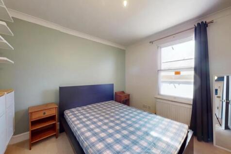 Bright and tidy double bedroom featuring a larg...