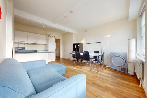 A bright and inviting living room featuring a c...