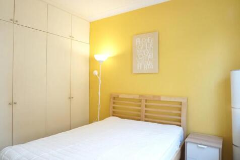 A bright and welcoming double bedroom featuring...