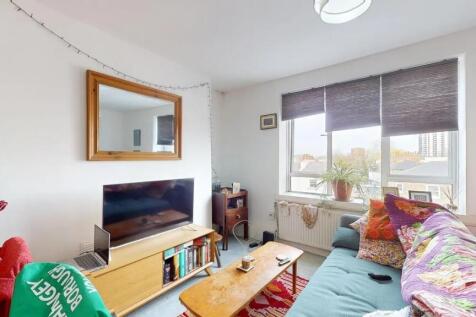 Bright and inviting living room featuring a lar...