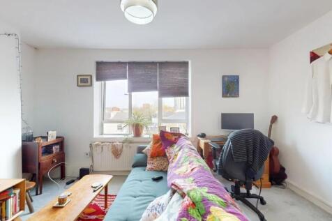 Bright and inviting living room featuring a com...