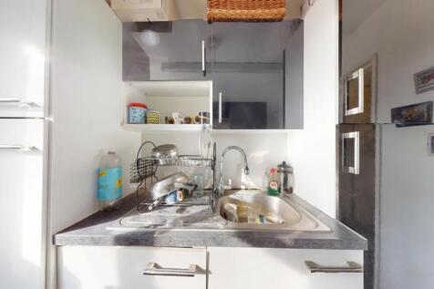 Bright and modern kitchen area featuring sleek ...