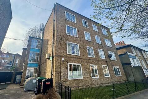 A well-maintained brick exterior of a multi-sto...