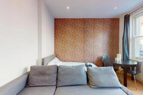 A modern double bedroom featuring a comfortable...