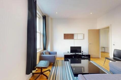 Bright and modern living room featuring comfort...