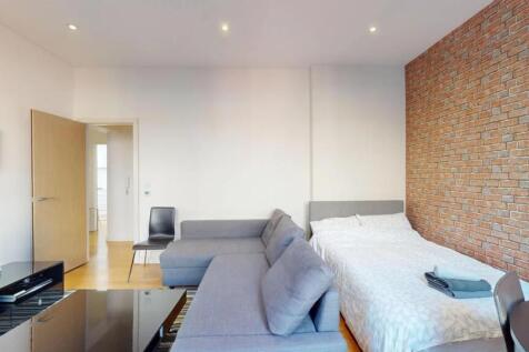 Bright and modern double bedroom featuring a st...