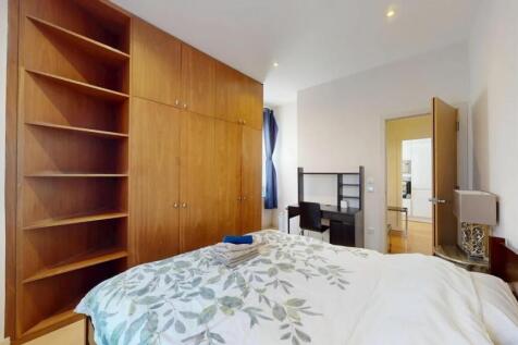 Bright and cozy double bedroom featuring a larg...