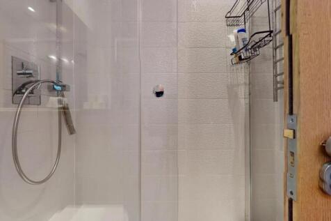 A modern, well-maintained bathroom featuring a ...
