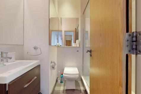 A clean and modern bathroom featuring a sleek s...
