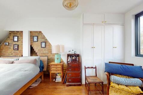 Bright and airy double bedroom featuring a larg...