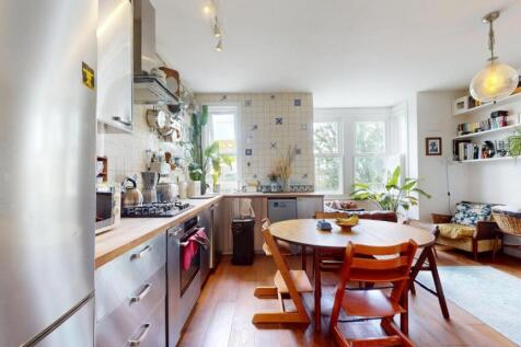 Bright and modern kitchen featuring sleek grey ...