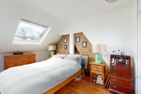 Bright and cozy double bedroom featuring a larg...