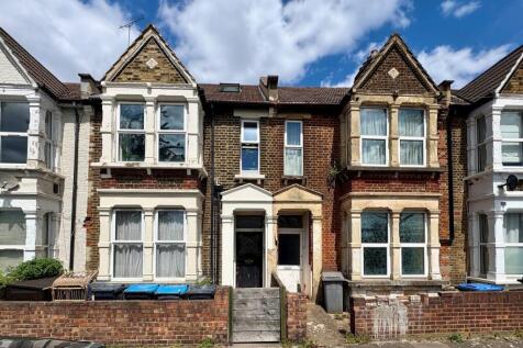A charming terraced house with classic brick an...