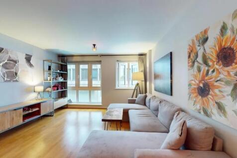 A bright and inviting living room featuring a l...
