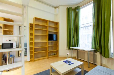 Bright and welcoming living room featuring larg...